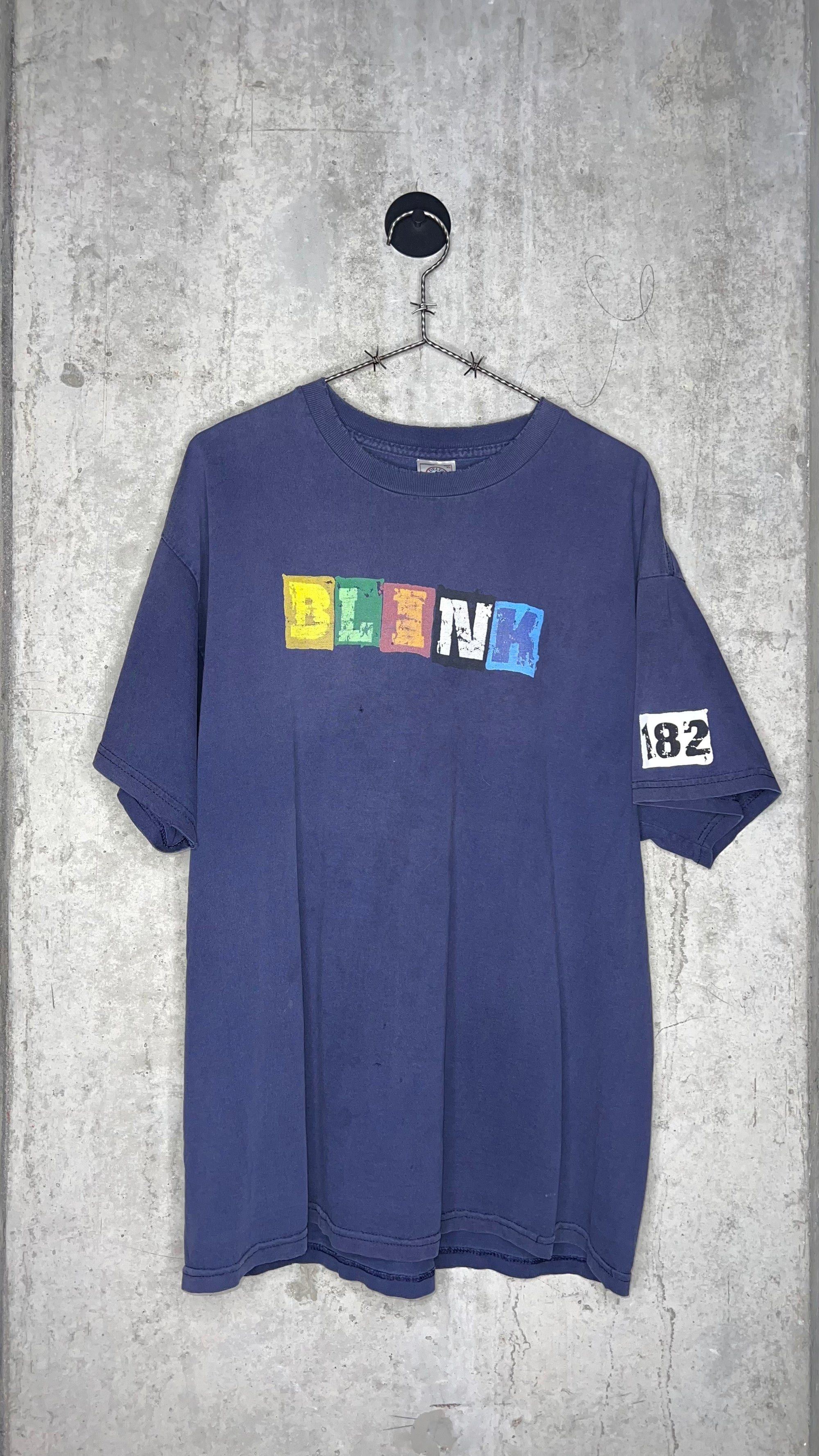 BLINK-182 RANSOM NOTE LETTER HIT CONCERT TEE | 182 SLEEVE HIT (LEFT SLEEVE VARIANT)