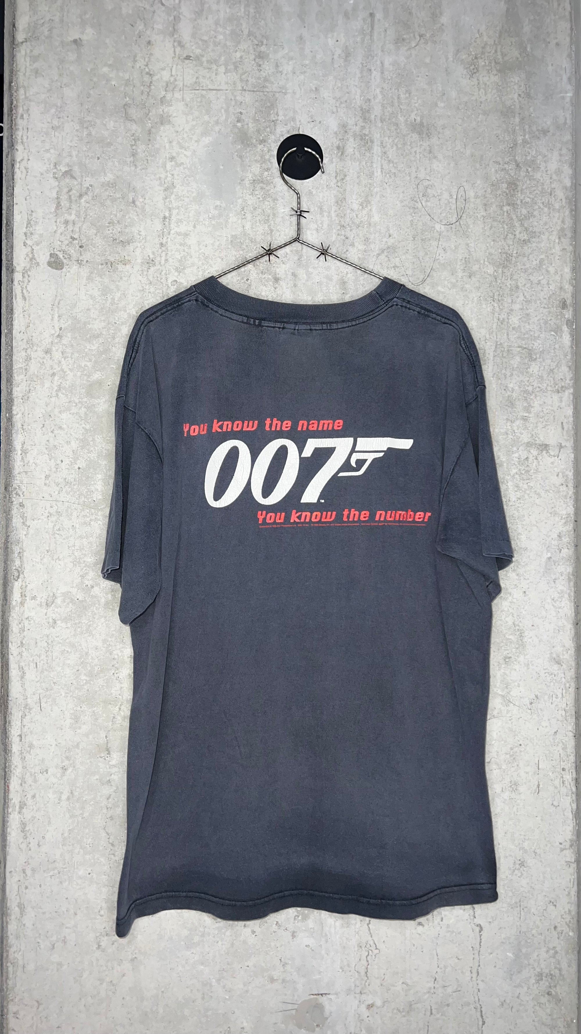 GOLDENEYE MOVIE PROMO MULLET TEE | “YOU KNOW THE NAME, YOU KNOW THE NUMBER” BACK HIT