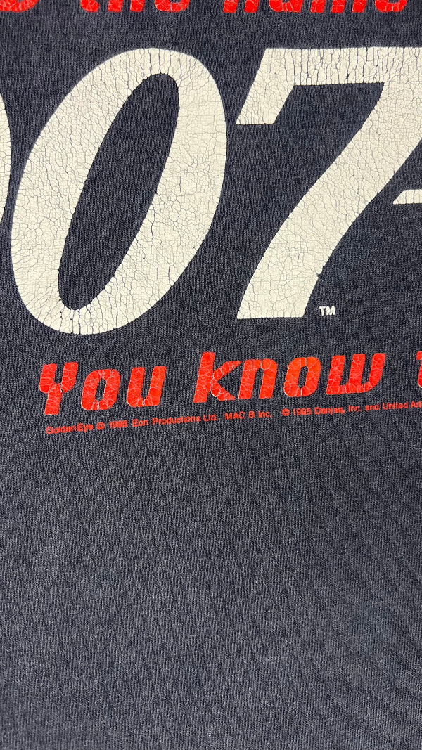 GOLDENEYE MOVIE PROMO MULLET TEE | “YOU KNOW THE NAME, YOU KNOW THE NUMBER” BACK HIT